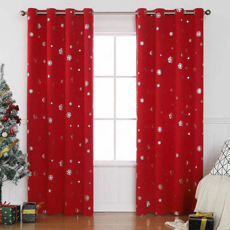 Red polyester snowflake pattern shade cloth curtain with lace loops hanging in modern interior setting