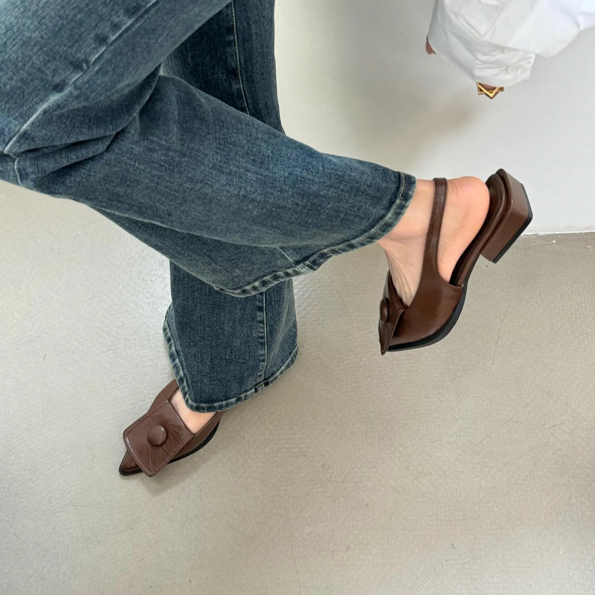Women's low heel pointed toe sandals in apricot with a back strap and closed toe design.