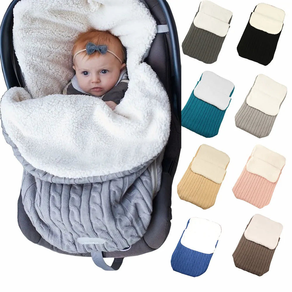 Envelope-style winter sleeping bag for a baby stroller in a neutral colour on a pushchair.