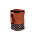 Leather retractable folding car trash can with handle shown in vehicle interior