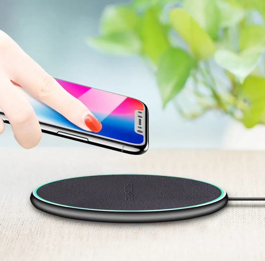 Black Qi wireless charging pad for iPhone 11 with integrated USB cable
