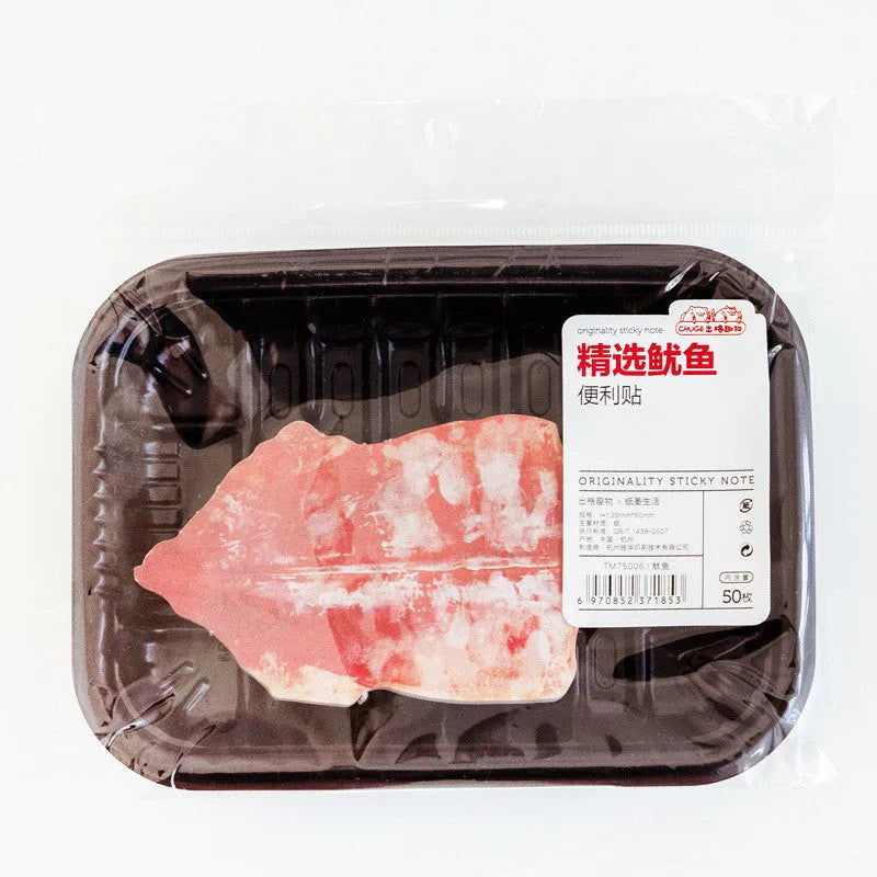Post-it notepad with food-themed cover showing bacon, salmon, bread and other designs