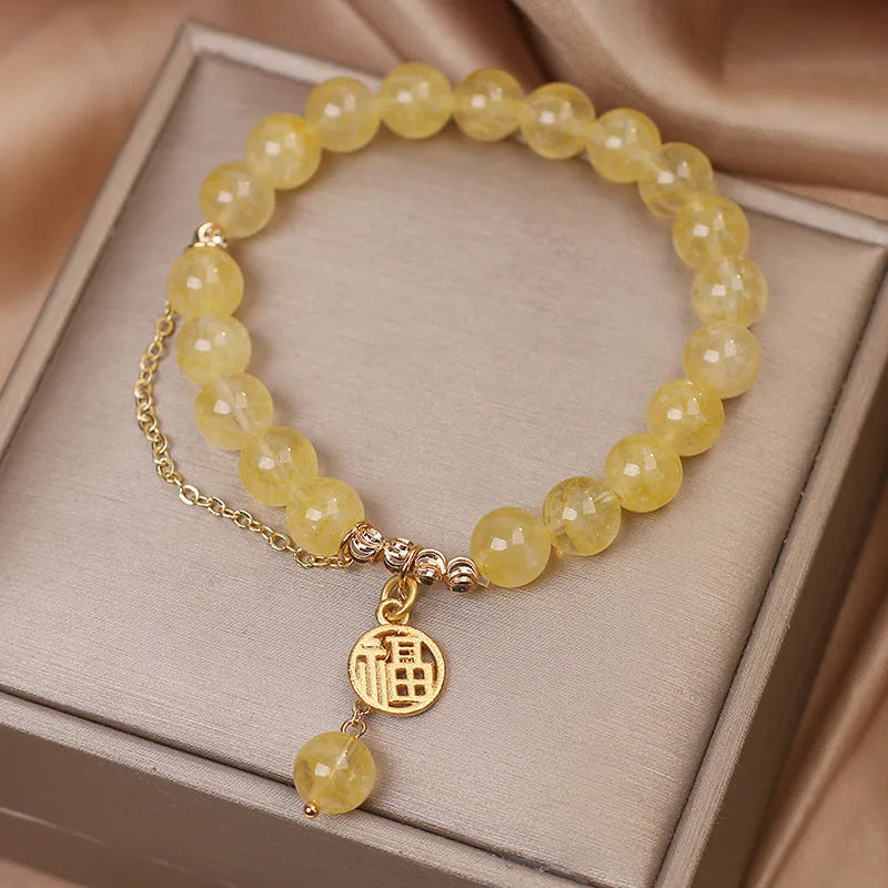 Natural citrine bracelet with Chinese character charm and decorative tassel in electroplated mixed materials