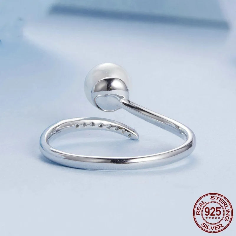 Sterling silver adjustable ring with natural shell pearls on open band design