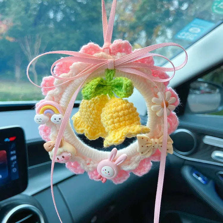 Handwoven wool bell orchid car pendant in green, shown hanging, with optional dream catcher accessory.