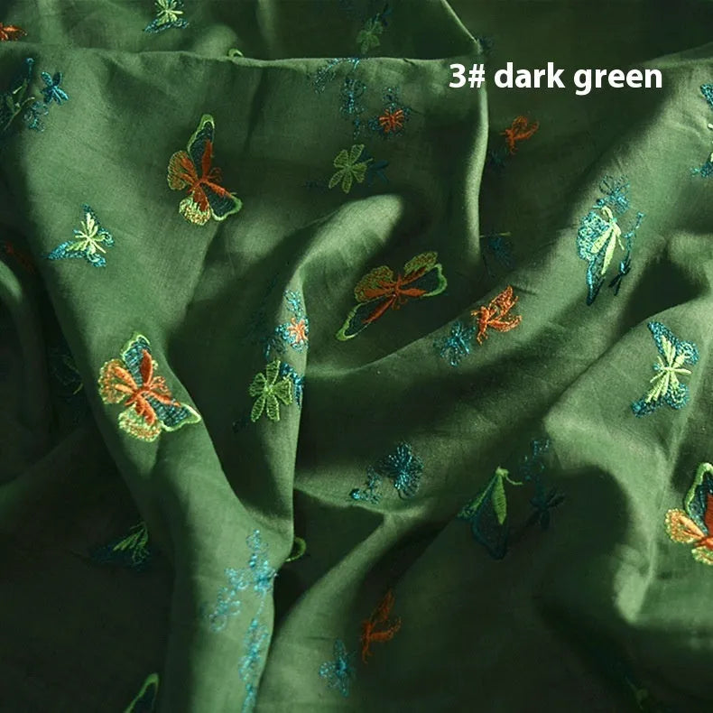 Pure ramie fabric for hanfu in beige, grass green, and dark green colours, showing texture.