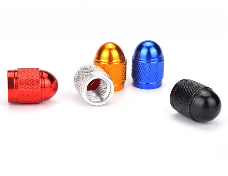 Aluminium alloy mountain bike tyre valve cap in gold, silver, red, blue, and black colours.