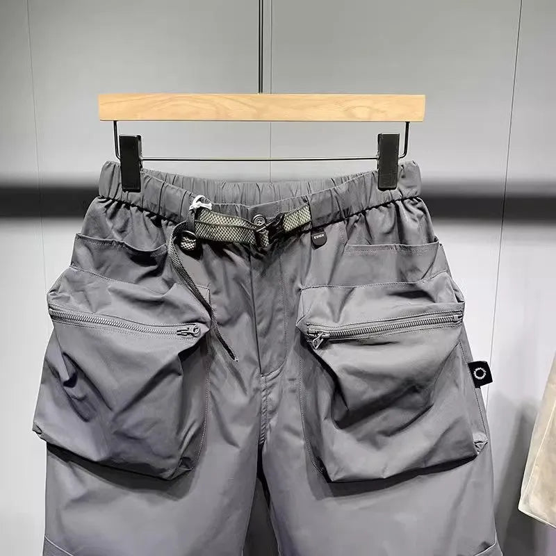 Men's large size workwear shorts in black with pockets and straight leg hem