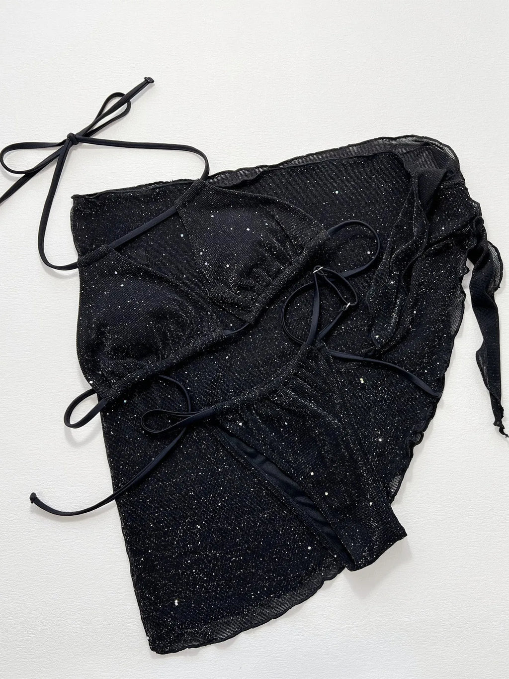 Black three-piece bikini swimsuit set with matching top and shorts