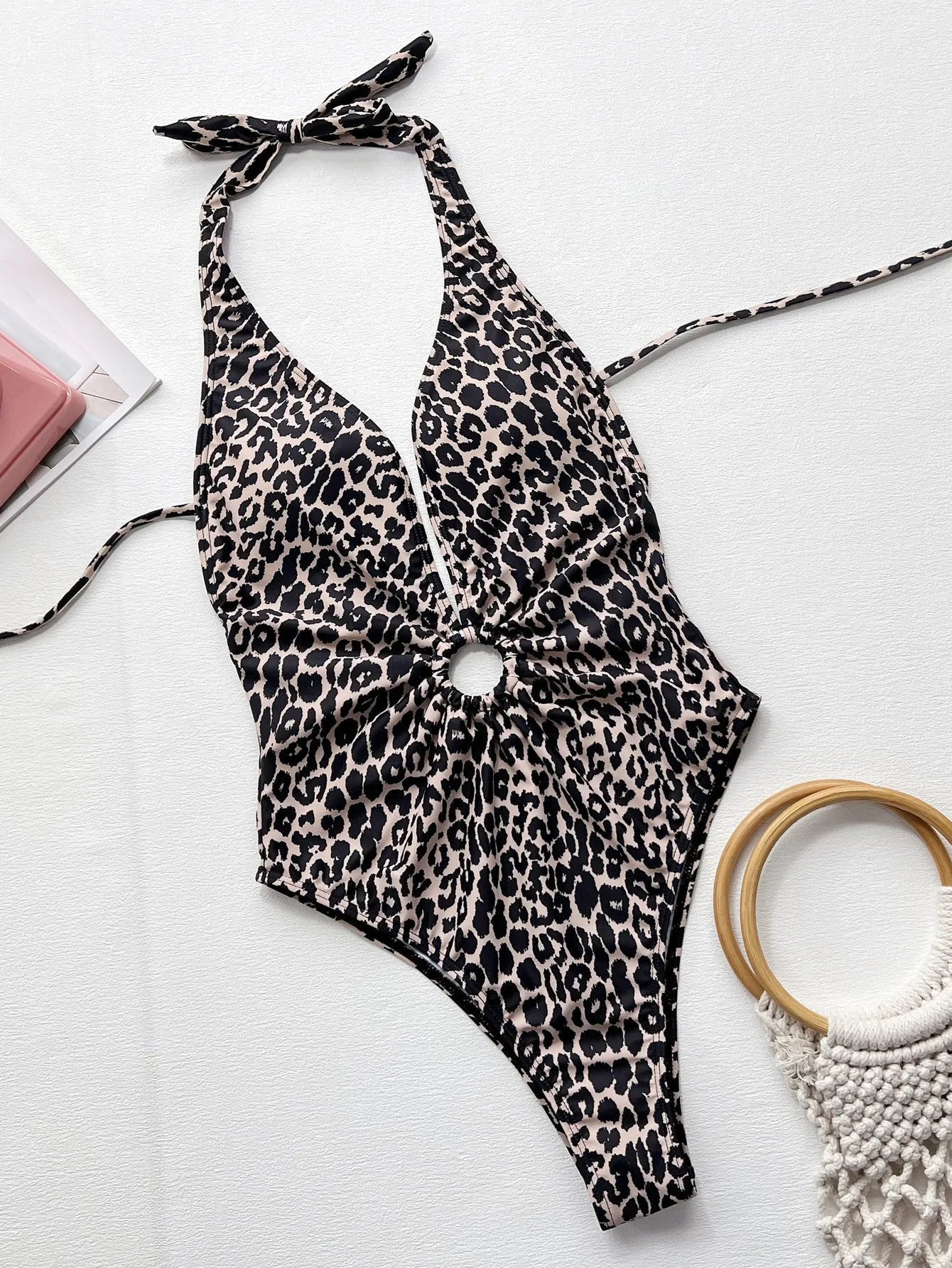 Leopard print one-piece swimsuit for women with hollow-out ring bikini design detail.