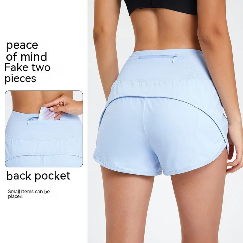 Women's high-waist quick-drying nylon fitness shorts in black, water blue, and white colours.