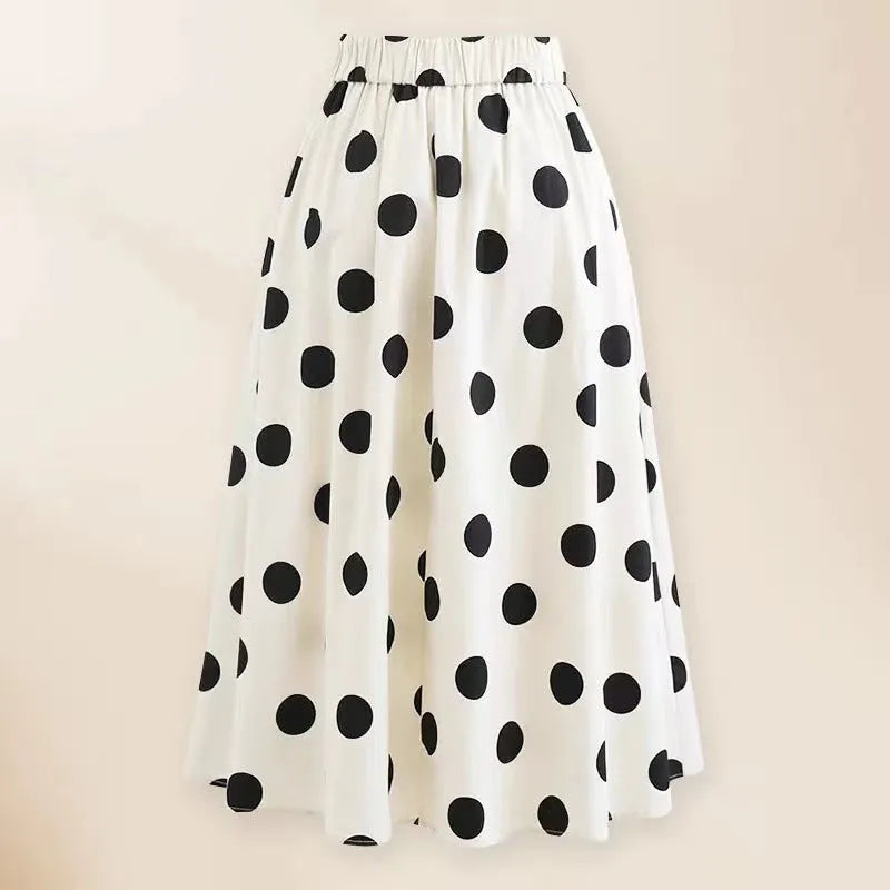 Women's black one-piece swimsuit with white round skirt and bow detail for swimming