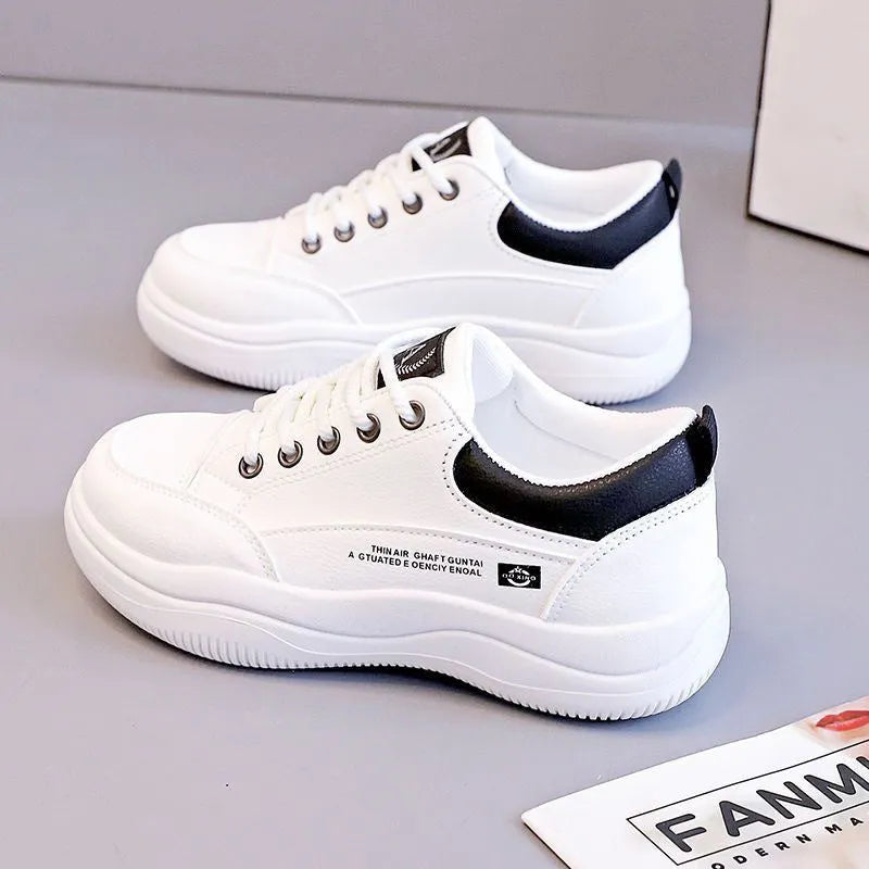 Women's white Korean-style lace-up pumps with cross straps and round toe, showing leather stitching details