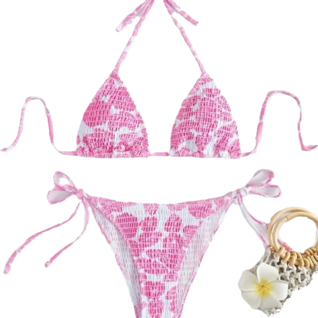 Women's multi-colour halter neck swimsuit bikini set with floral pattern on a mannequin