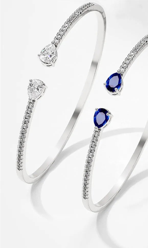 Copper bracelet with multi-zircon decorative inlay in simple style, shown in blue and white colour options