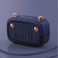 Compact black portable Bluetooth speaker showing card-sized dimensions with control buttons and USB port