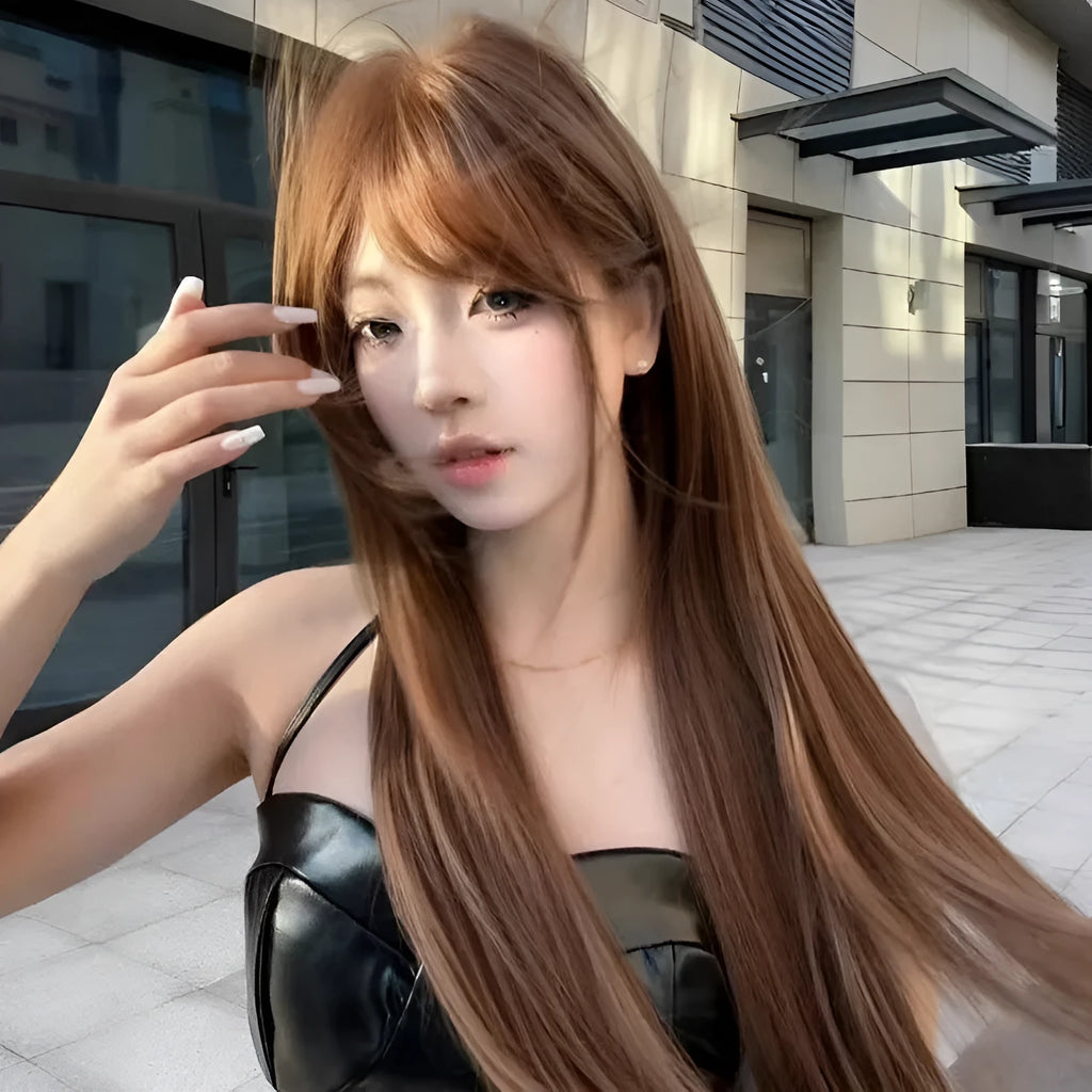 Warm brown long straight synthetic wig with a full fringe on a model.