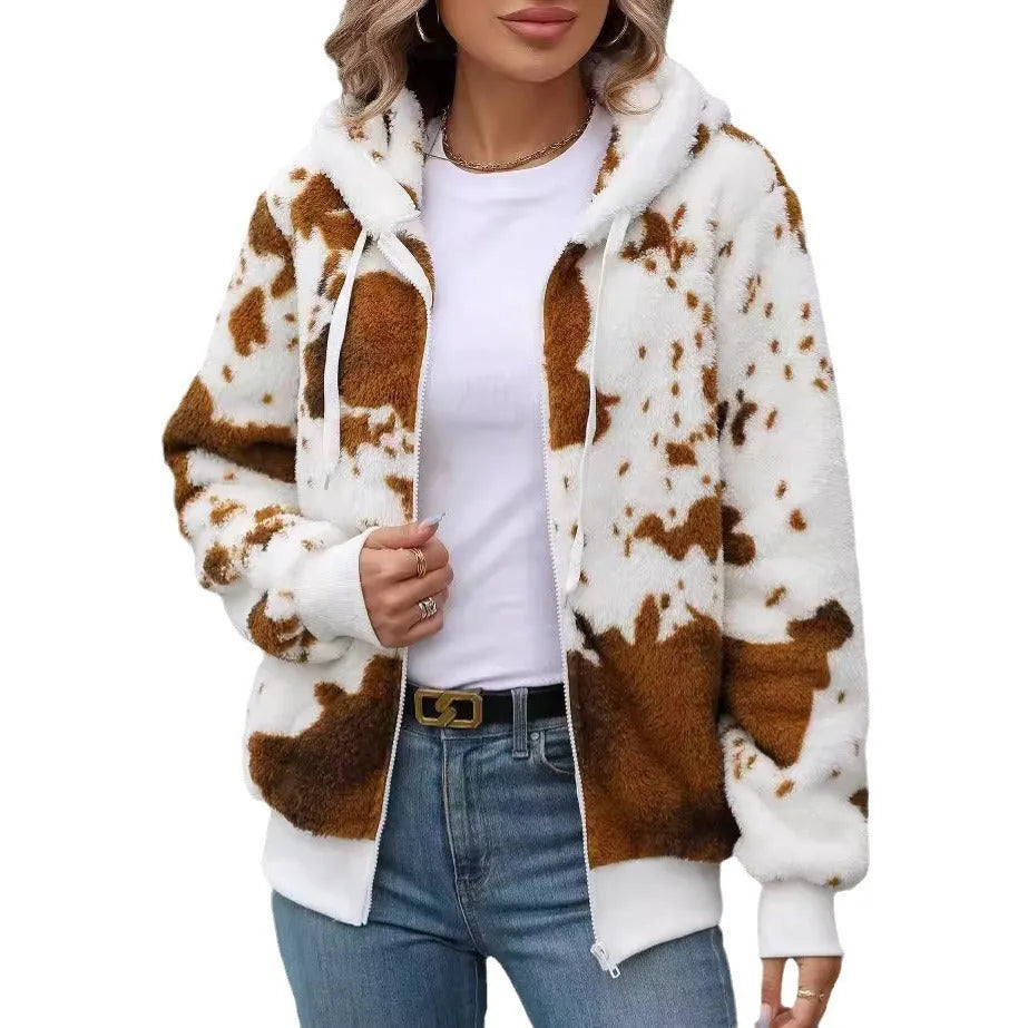 Yellow brown cow animal print hooded cardigan jacket with zip front on a hanger