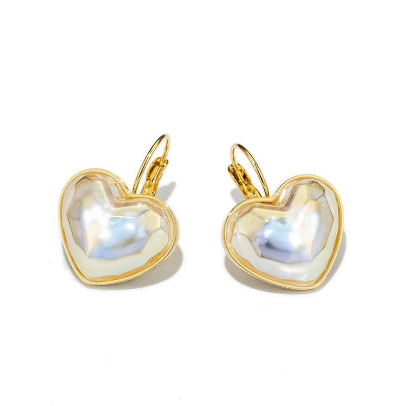 A pair of gold-coloured alloy clip-on earrings for women with a natural style.