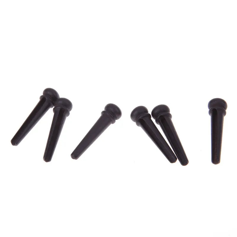 Six ebony folk guitar string nails with matt black finish for acoustic guitar repair