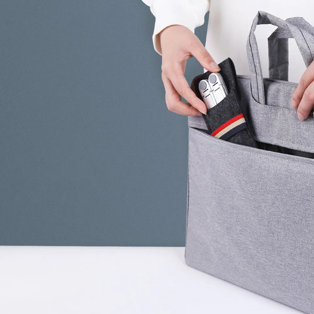 Portable aluminium laptop stand folded showing adjustable height mechanism