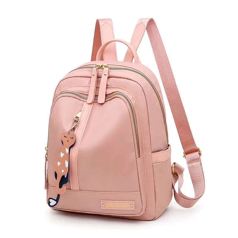Women's casual nylon backpack in black or pink with water-resistant features and internal organisation compartments