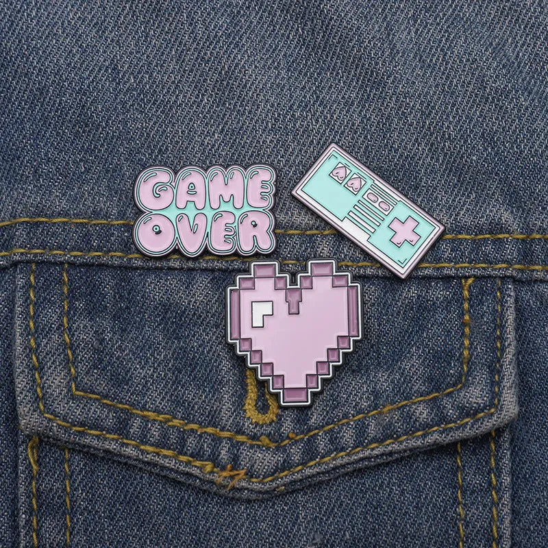 Alloy game console badge with magnetic backing in CC1122, CC1123, and CC1124 colour options