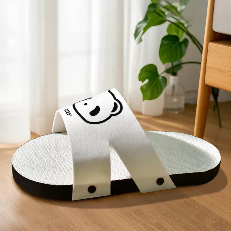 White slipper-style corrugated paper cat scratch board lying flat.