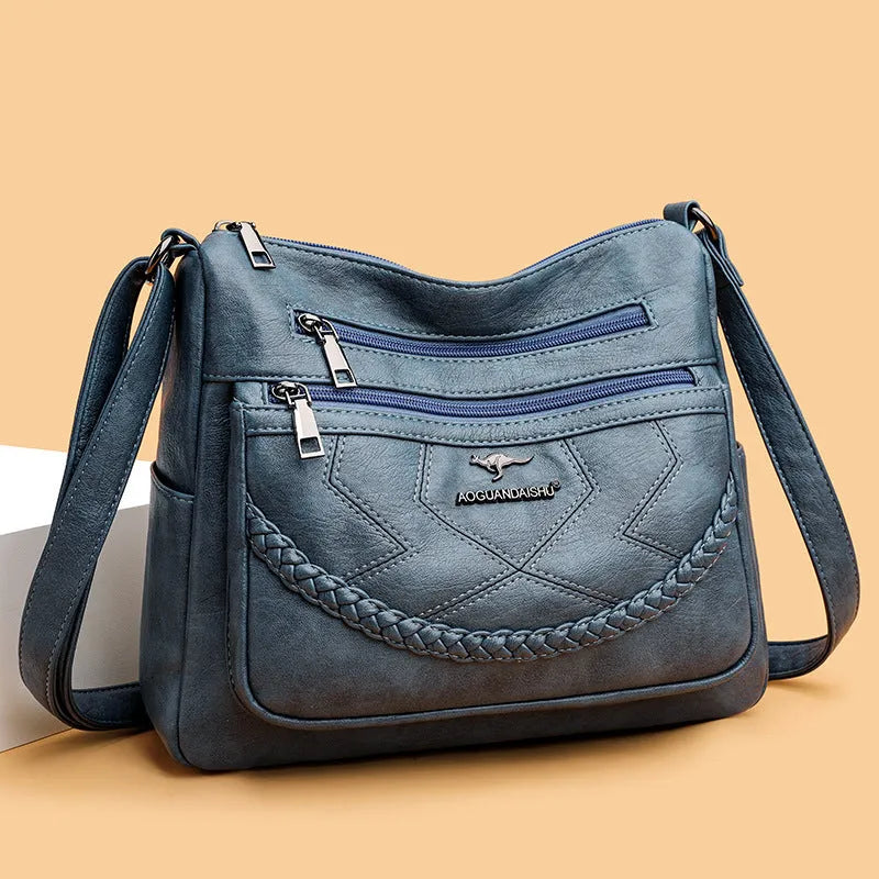 Soft black PU leather women's crossbody bag showing square shape and outer pocket