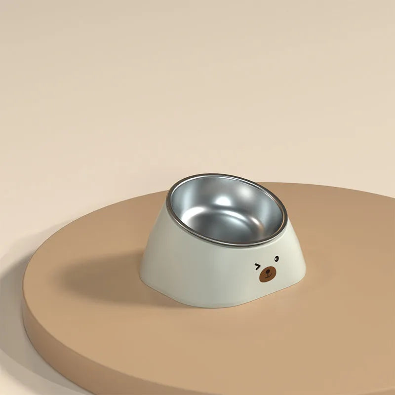 Green tilted stainless steel cat bowl with non-slip white base at a 15 degree angle