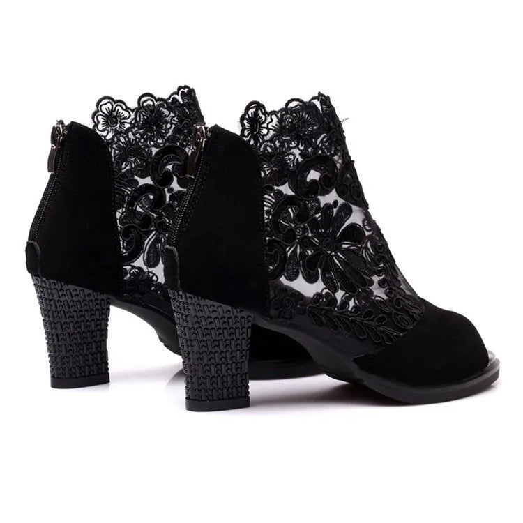 Women's black gladiator sandals with flower lace detailing, square heels, and zip closure