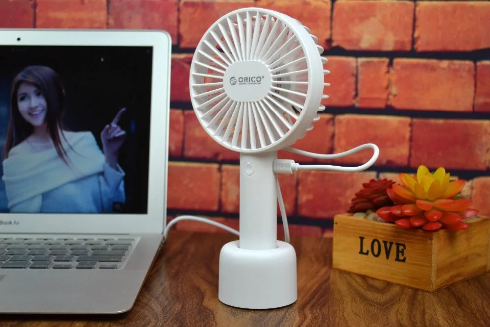 White ORICO FH1 USB rechargeable portable fan with fine line details on desktop