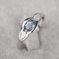 Geometric ellipse zircon ring in white gold colour showing structured design and stone inlay