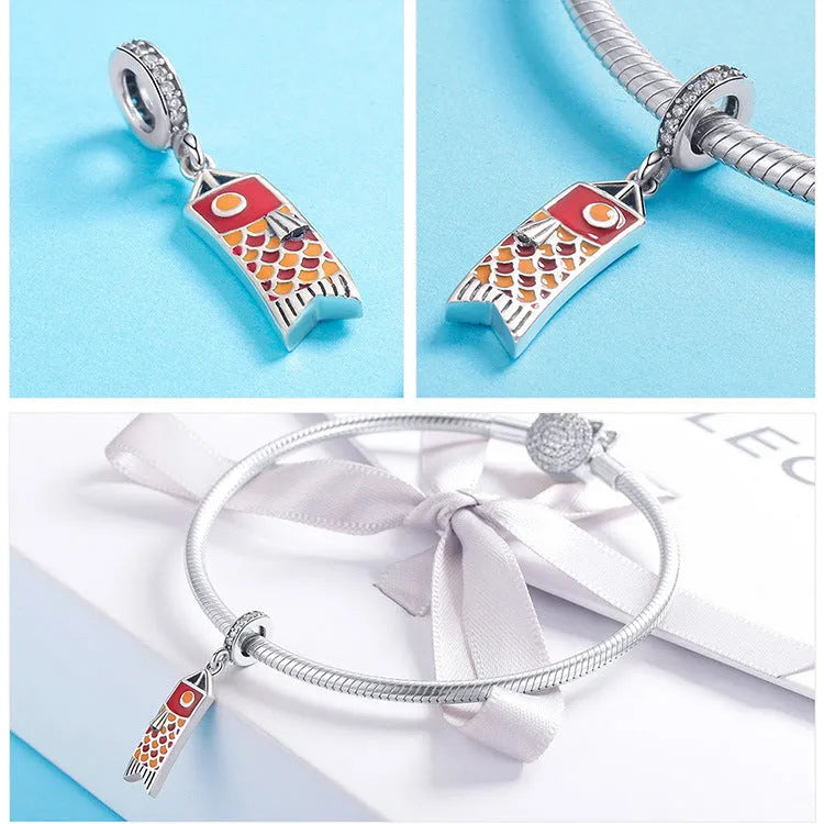 S925 sterling silver carp streamer pendant charm with zircon details on a white background