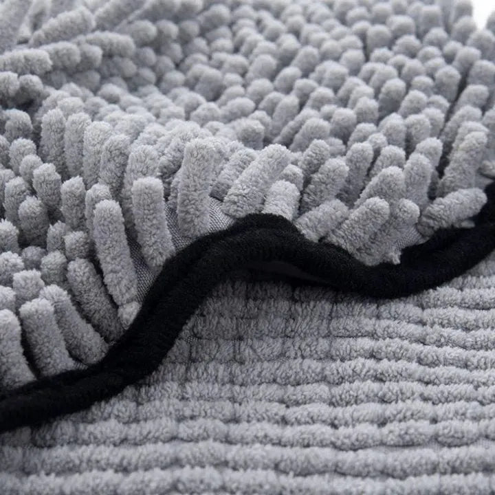 Blue dog bath robe towel laid flat showing 62cm by 23cm size and soft fibre texture
