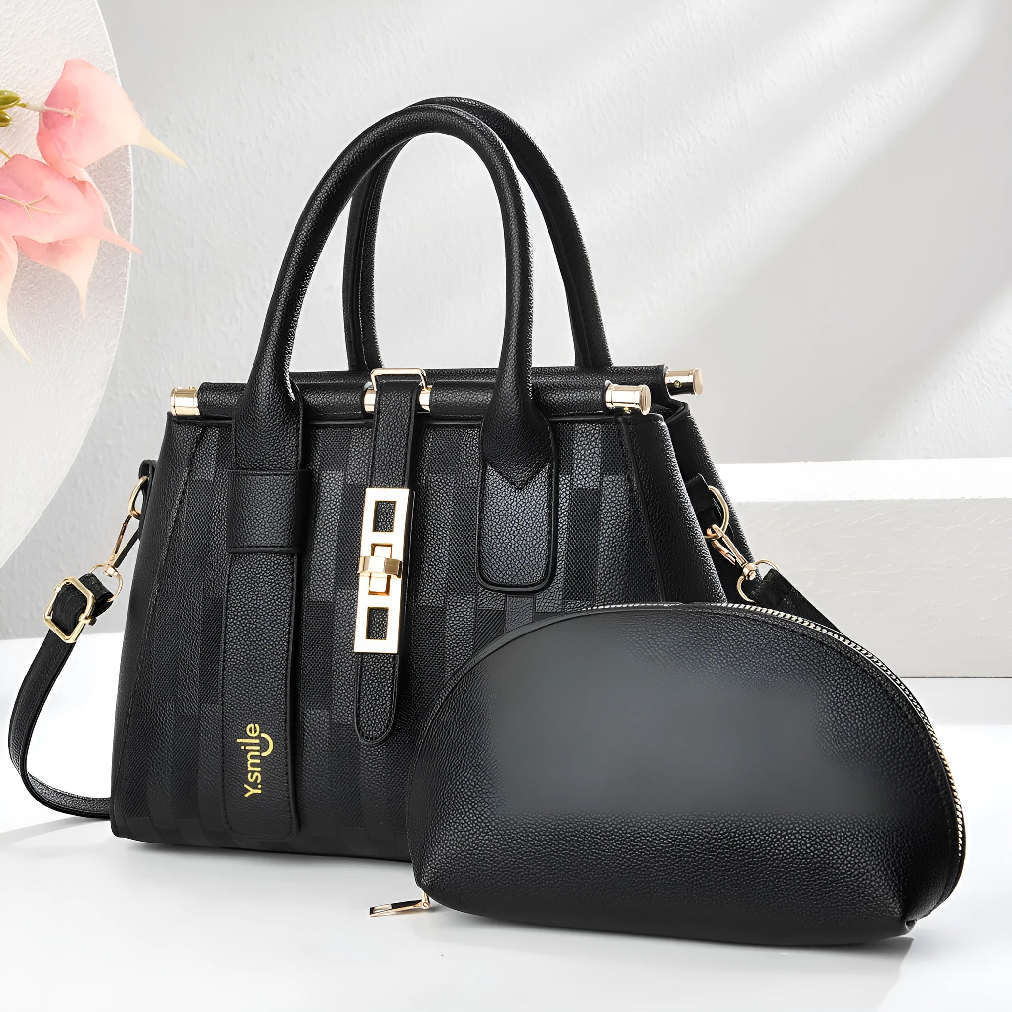 Women's round black crossbody handbag made of soft PU leather with an adjustable strap