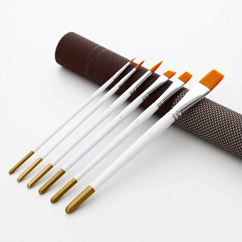 Set of six wood-handled artist paint brushes with aluminium ferrules on a white background.