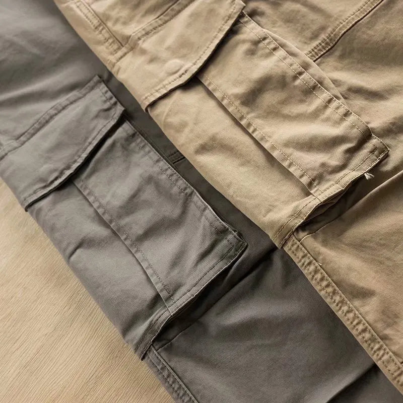 Men's multi-pocket cotton work trousers in khaki colour with cropped leg design showing utility pockets