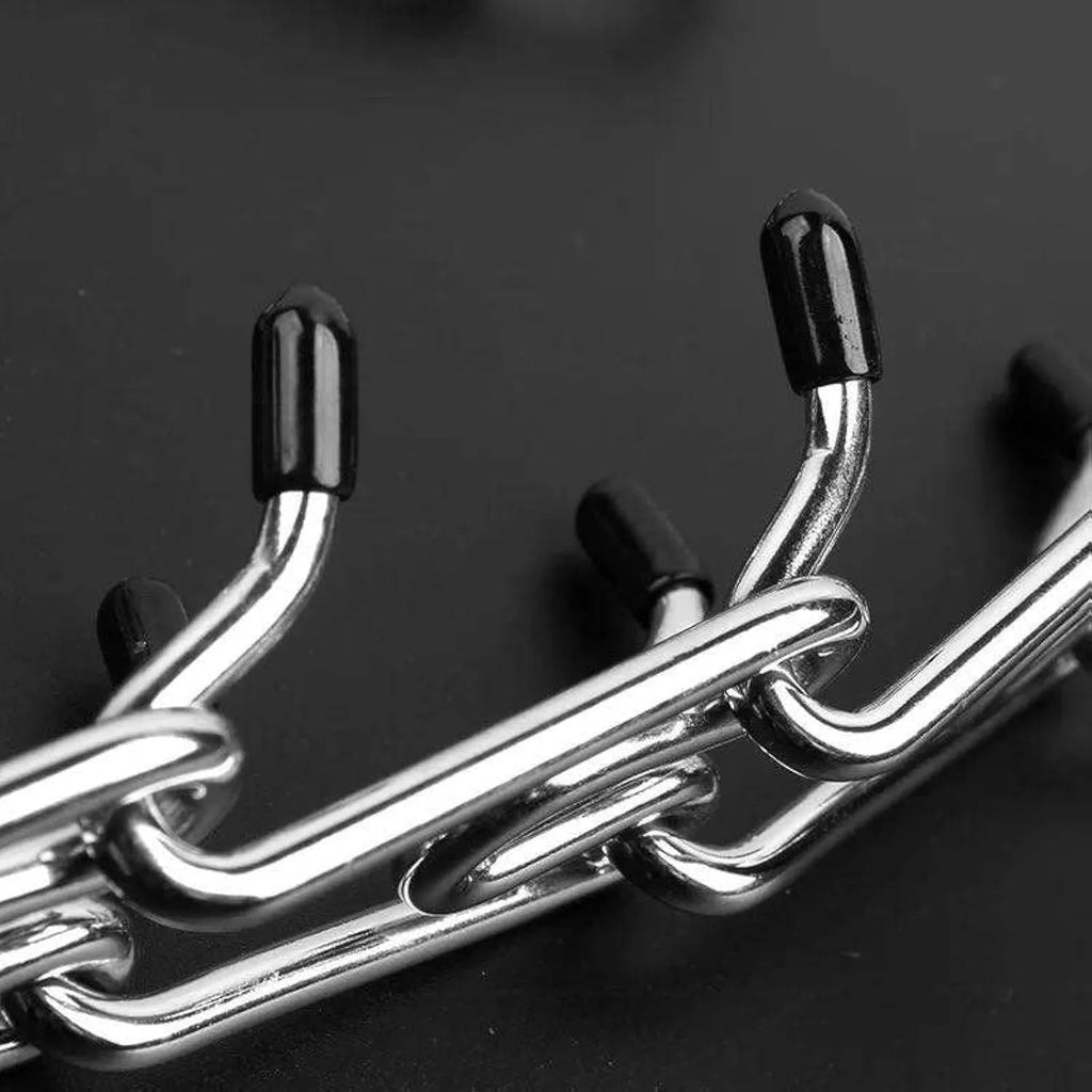 Stainless steel dog training pinch collar with rubber tips showing adjustable chain links