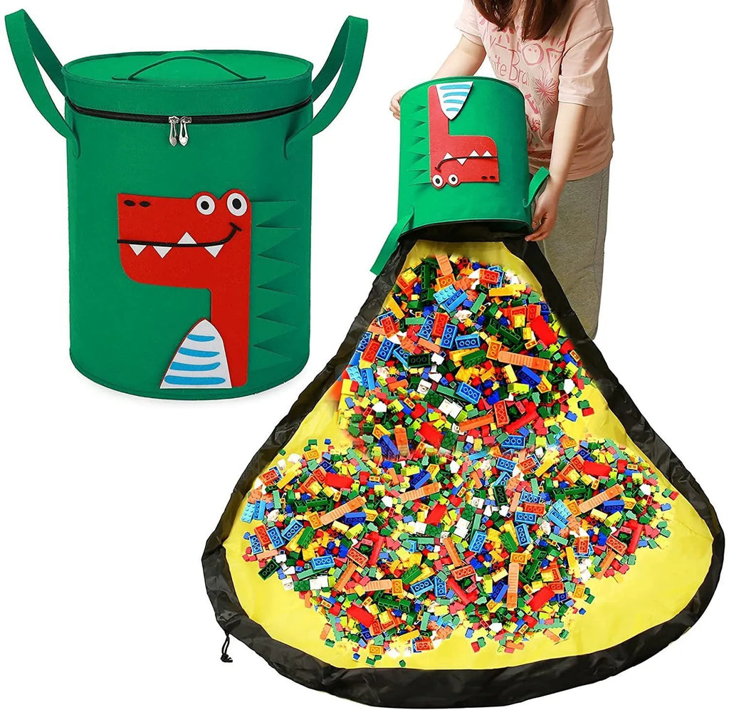 Green felt cube storage bag open showing toys inside, laying flat as play mat