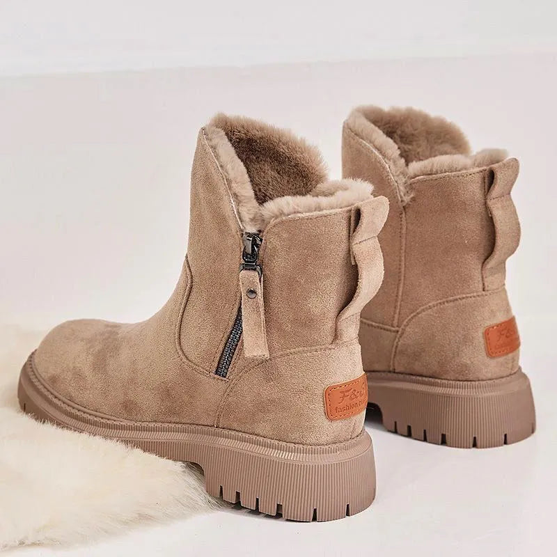 Women's black high-top faux suede snow boot with side zipper and non-slip sole.