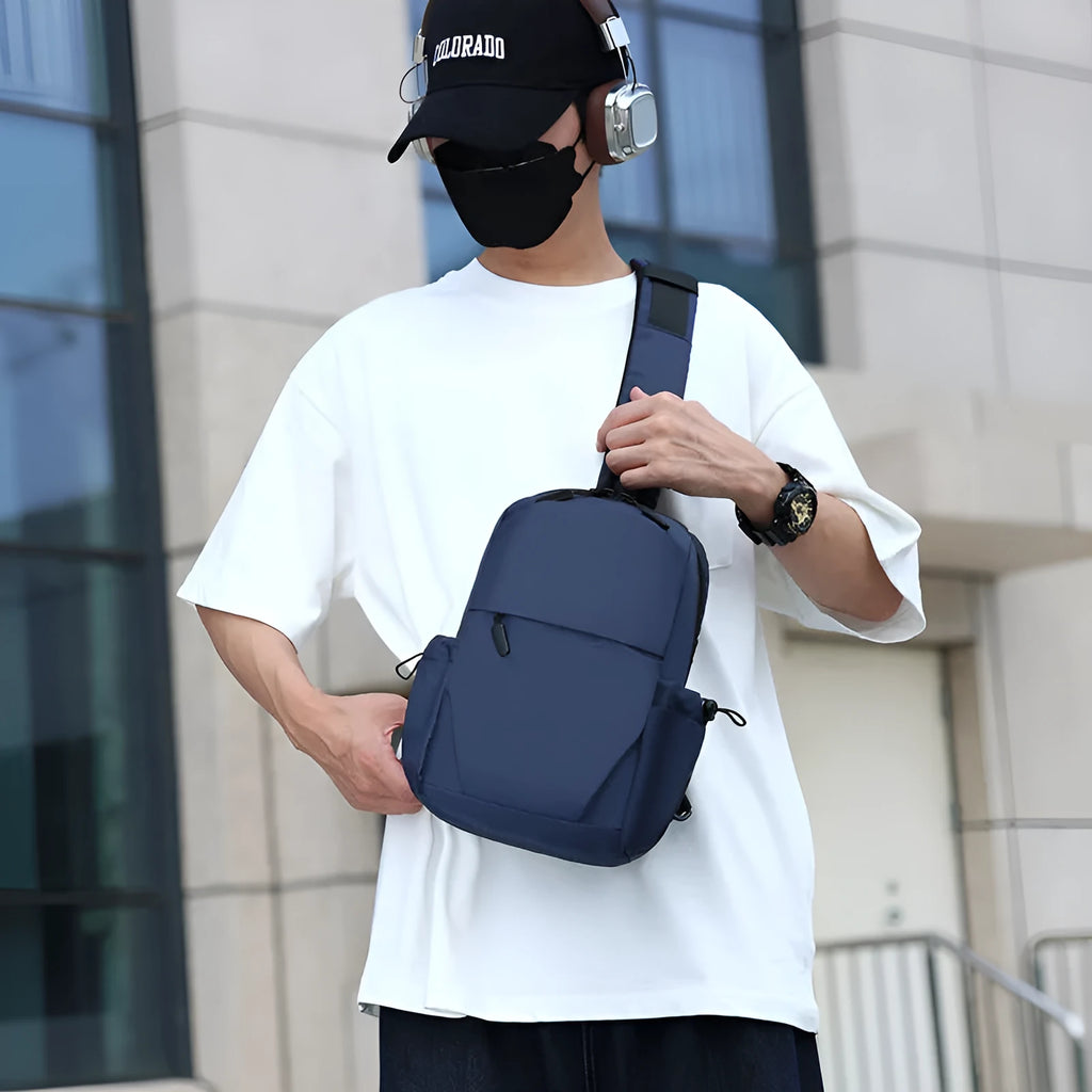 Men's grey lightweight waterproof chest bag with shoulder strap showing front compartment.