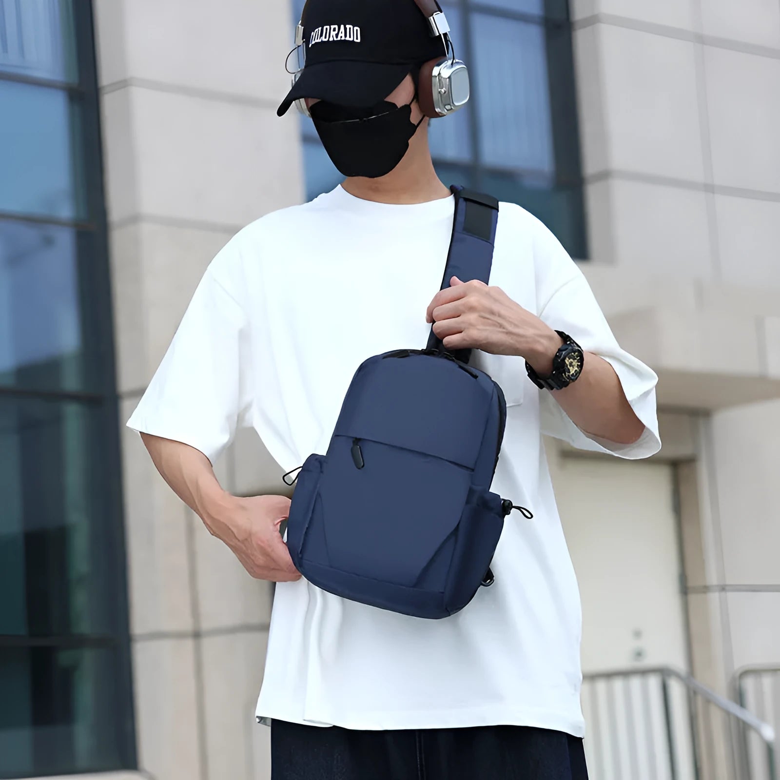 Men's grey lightweight waterproof chest bag with shoulder strap showing front compartment.