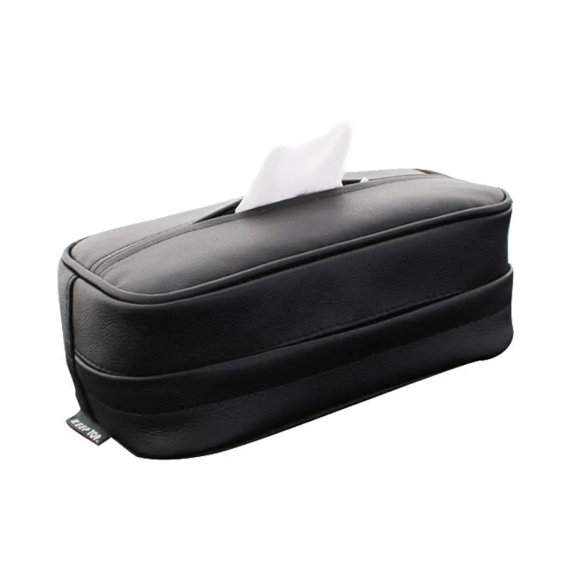 Black PU leather car storage box with hanging straps shown on a car headrest.