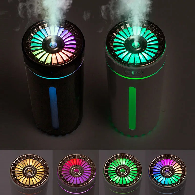 Black USB rechargeable ultrasonic humidifier with LED lights on a car cup holder