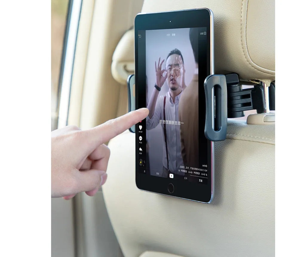 Black universal car phone holder mounted on a rear seat headrest, holding an iPad.