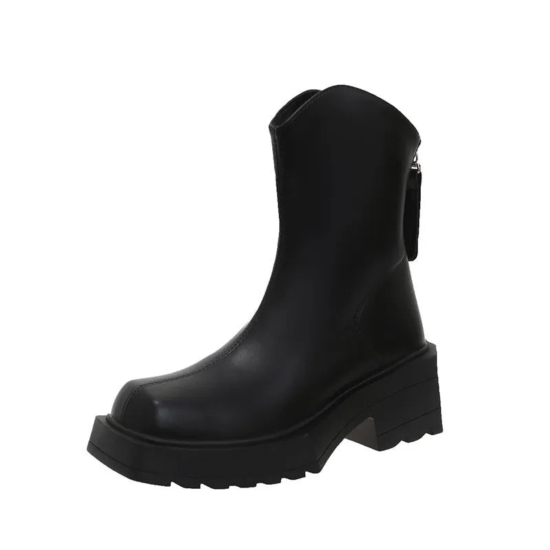 Women's black platform Martin ankle boots with square toe, chunky heel, and back zipper on a plain background.