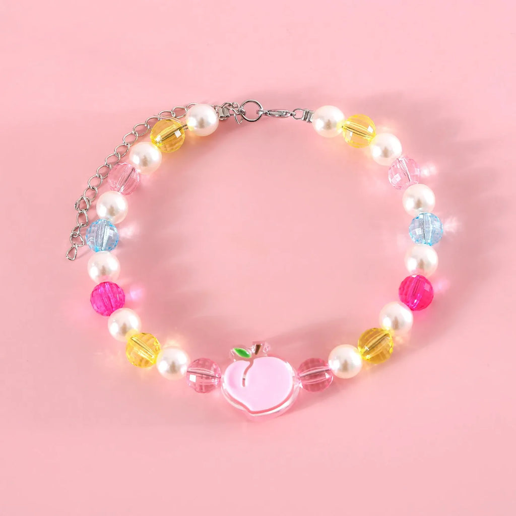 Colourful plastic bead cat necklace with adjustable sizing in peach, rainbow or small flower patterns