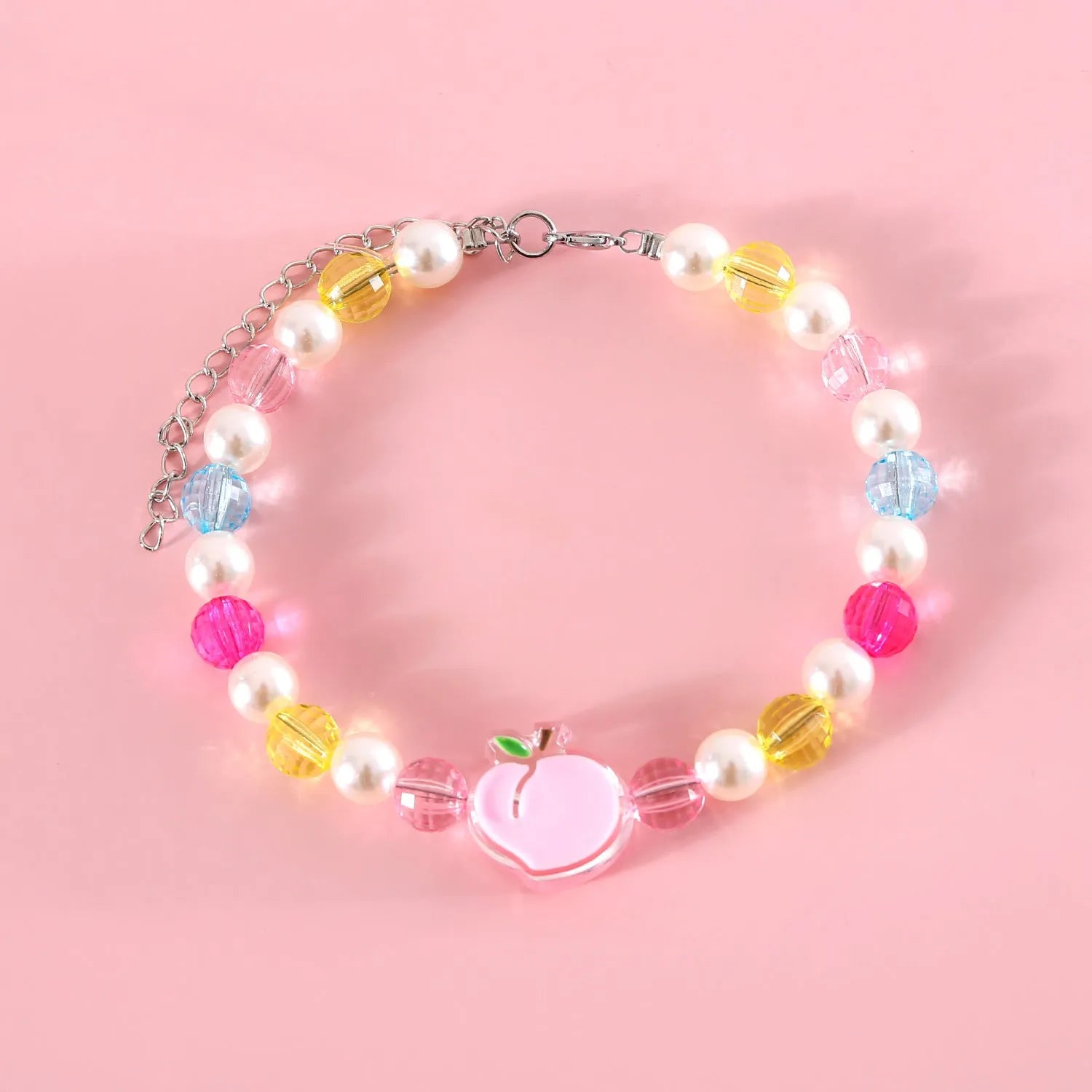 Colourful plastic bead cat necklace with adjustable sizing in peach, rainbow or small flower patterns
