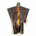Plastic Halloween decoration showing luminous hanging ghost with blood-dyed skull design